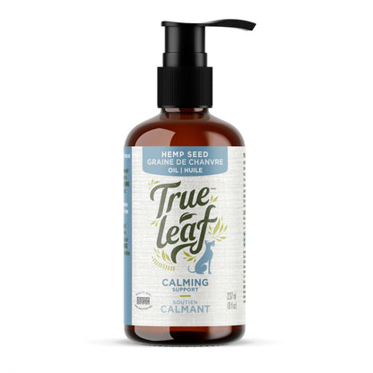 A bottle of True Leaf brand Calming Support Oil for pets with a pump dispenser, featuring product information and branding.
